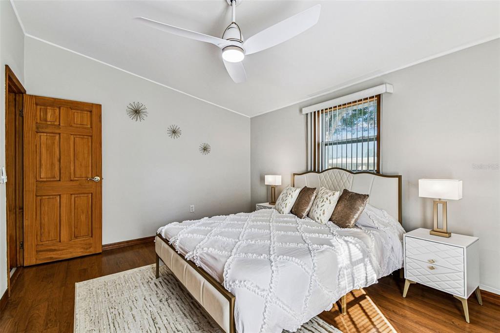 226 Maple Avenue Palm Harbor, FL 34684 - Photo 39 of 79 a bedroom with a large bed and a window