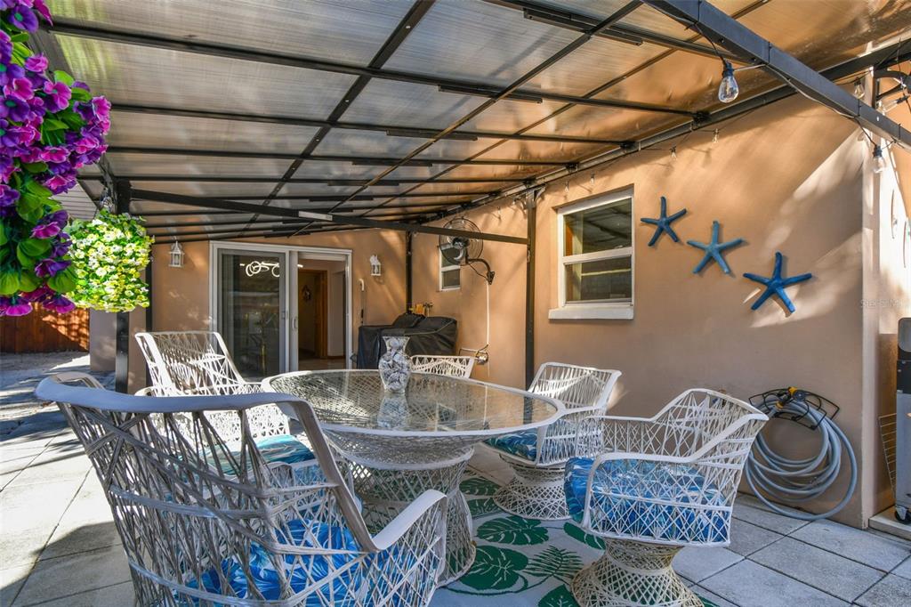 226 Maple Avenue Palm Harbor, FL 34684 - Photo 40 of 79 a view of an outdoor sitting area with couch