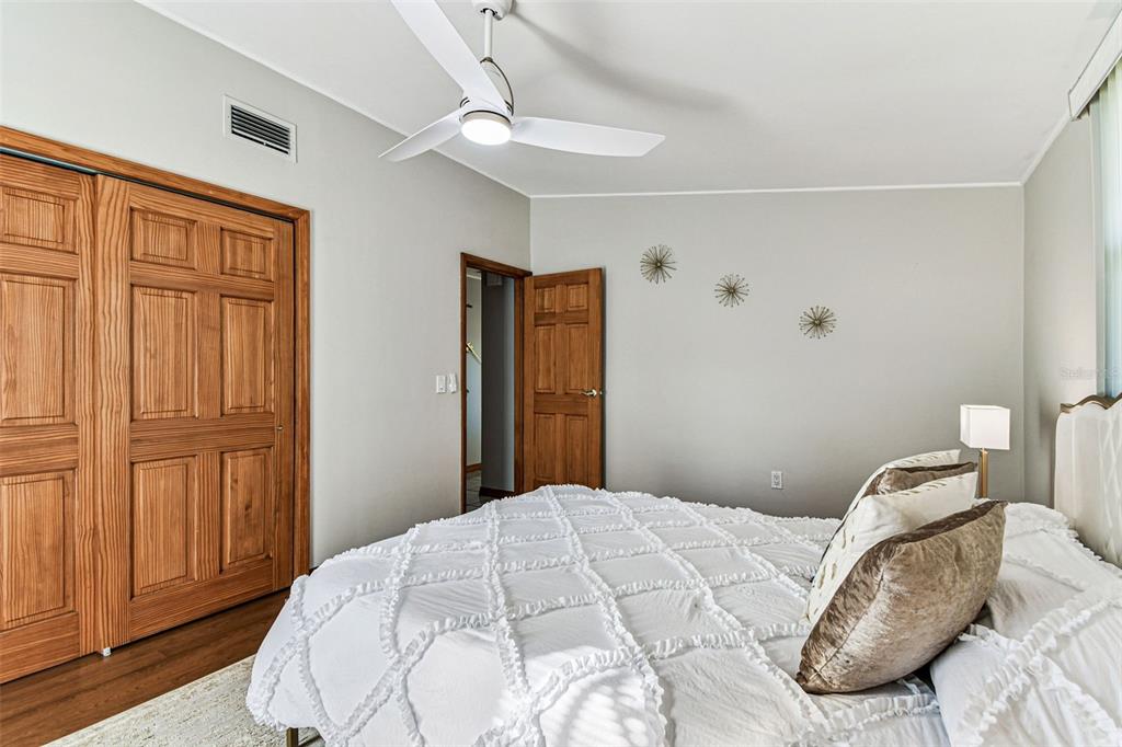 226 Maple Avenue Palm Harbor, FL 34684 - Photo 44 of 79 a bedroom with a bed and a dresser