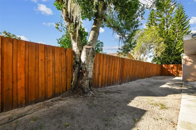 a backyard of a house with lots of green space