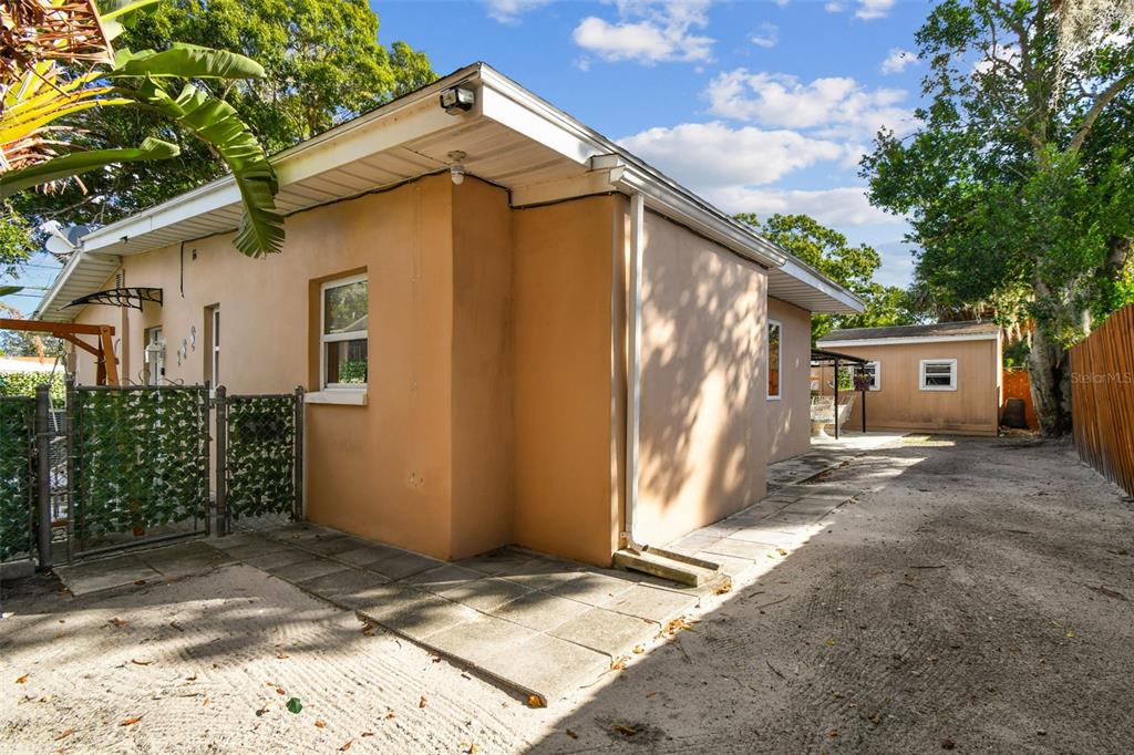 226 Maple Avenue Palm Harbor, FL 34684 - Photo 49 of 79 a view of a house with a yard and tree