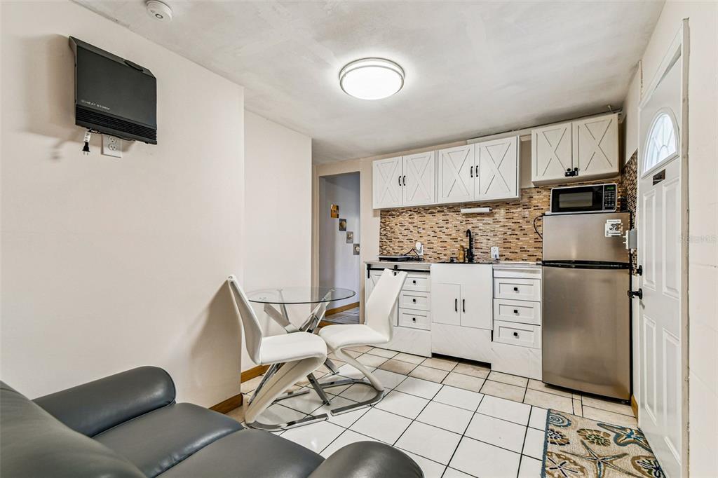 226 Maple Avenue Palm Harbor, FL 34684 - Photo 56 of 79 a kitchen with stainless steel appliances a refrigerator and a stove top oven