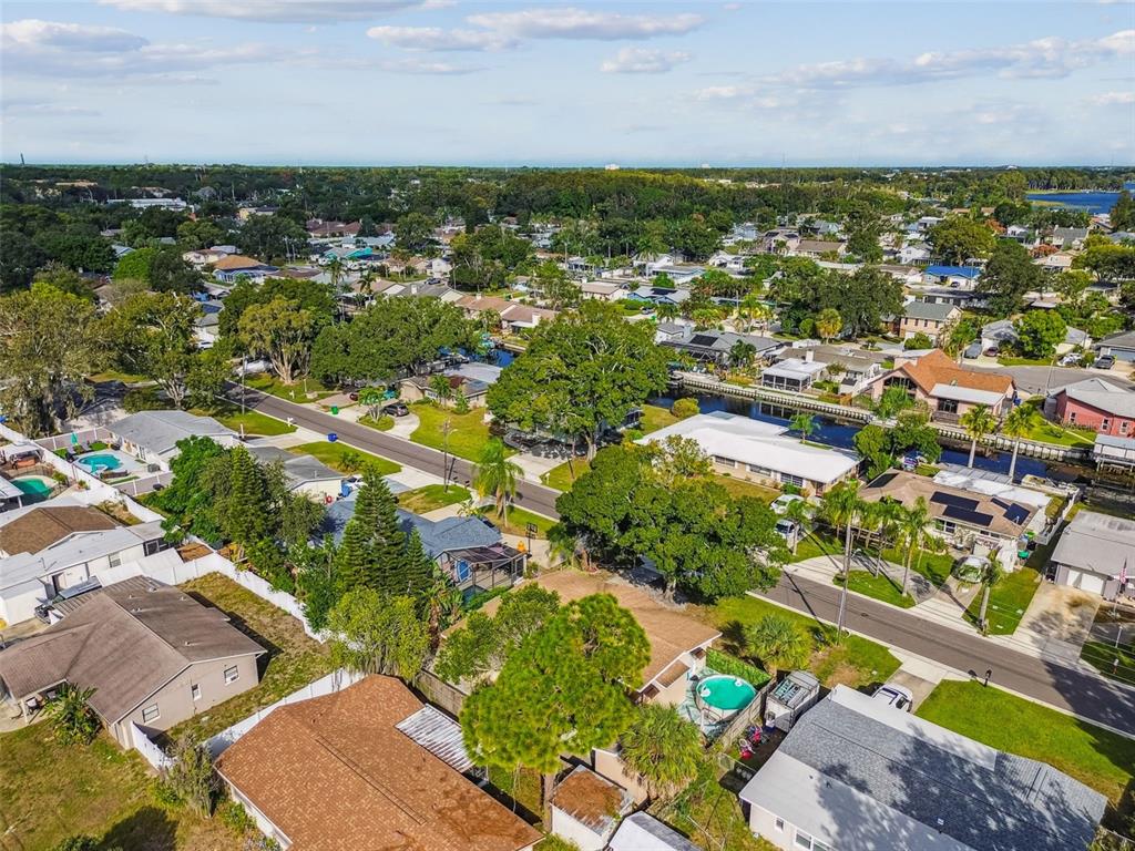 226 Maple Avenue Palm Harbor, FL 34684 - Photo 71 of 79 an aerial view of residential houses with outdoor space and trees