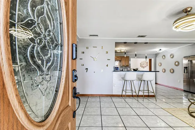a kitchen with a stove a sink and a microwave