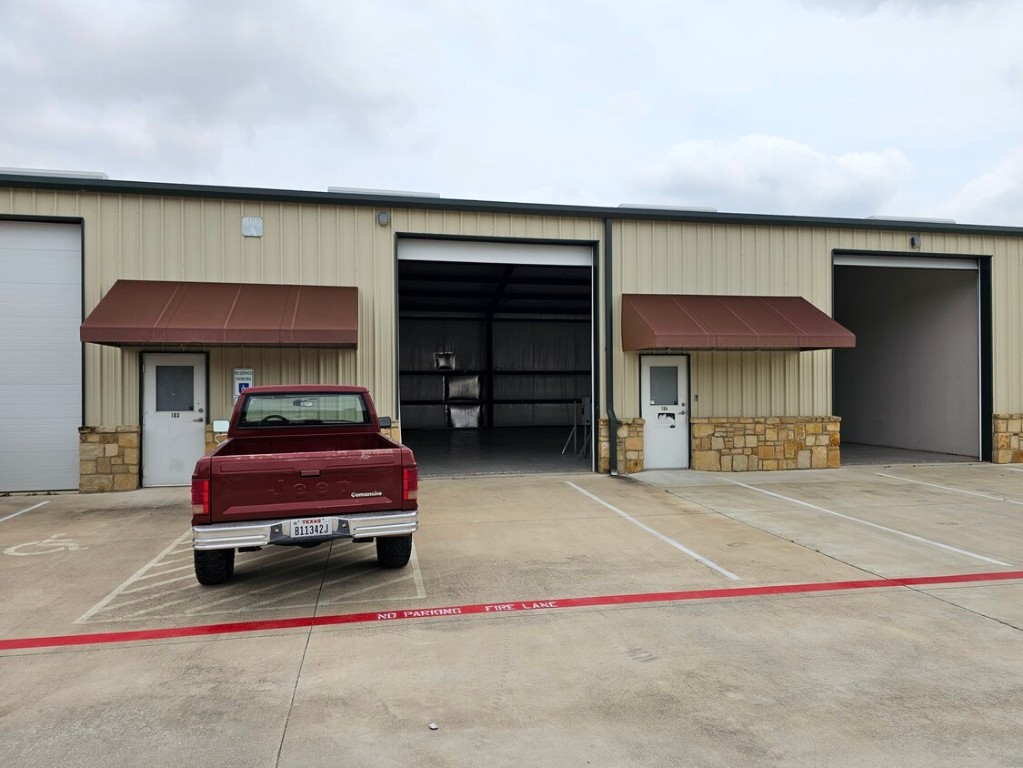 4819 R O Drive, Unit 201 Spicewood, TX 78669 - Photo 11 of 21 a car parked in garage
