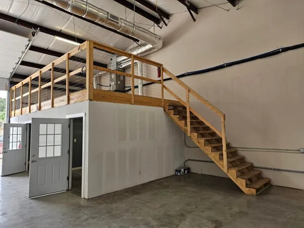 a view of a storage & utility room with racks on the wall