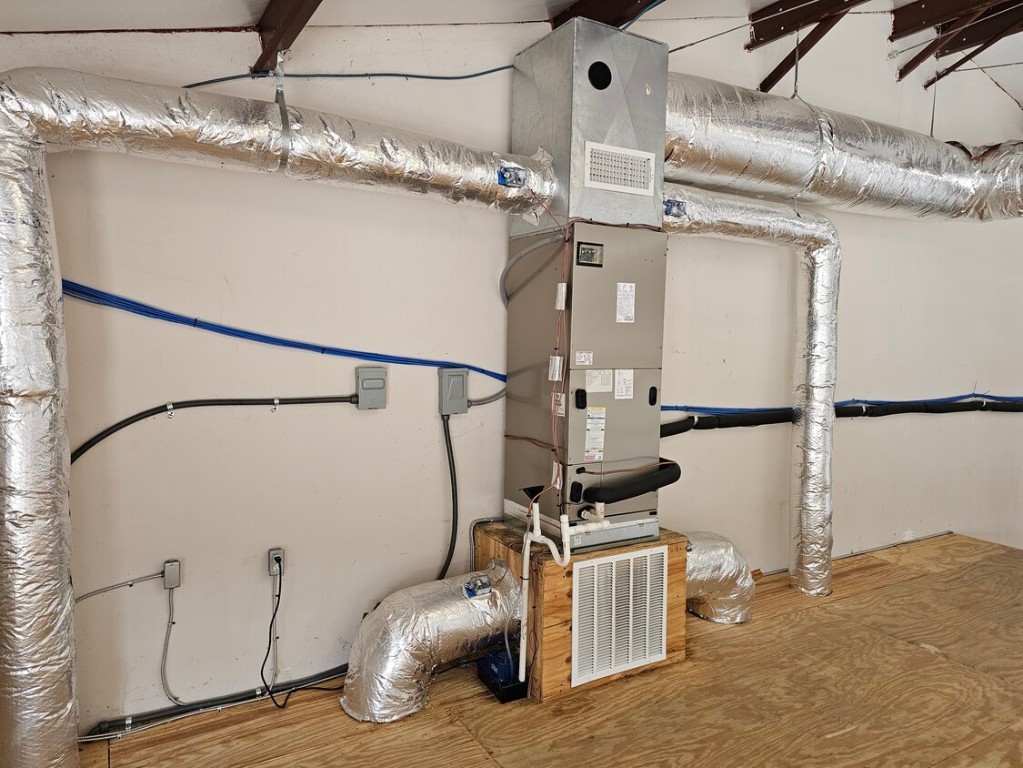 4819 R O Drive, Unit 201 Spicewood, TX 78669 - Photo 17 of 21 a view of a storage & utility room with racks on the wall