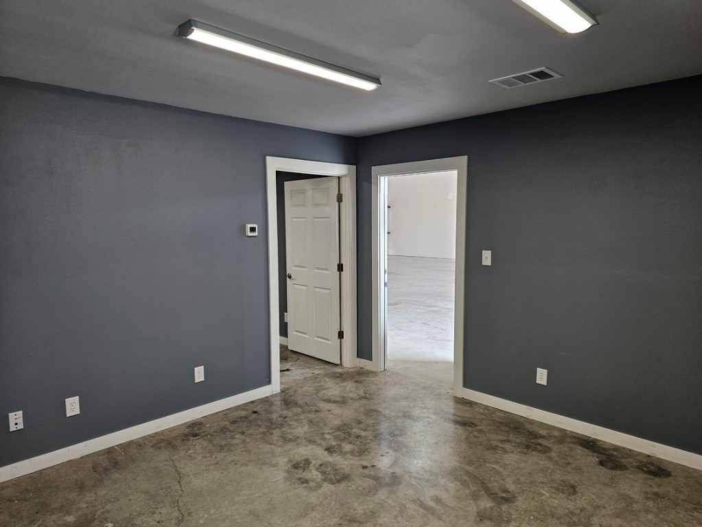 4819 R O Drive, Unit 201 Spicewood, TX 78669 - Photo 20 of 21 an empty room with closet and wooden floor