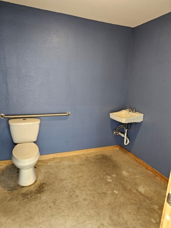 4819 R O Drive, Unit 201 Spicewood, TX 78669 - Photo 21 of 21 a bathroom with a toilet