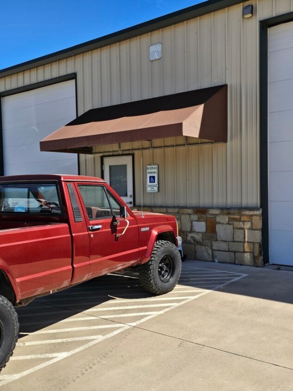 4819 R O Drive, Unit 201 Spicewood, TX 78669 - Photo 3 of 21 a car parked in front of a building