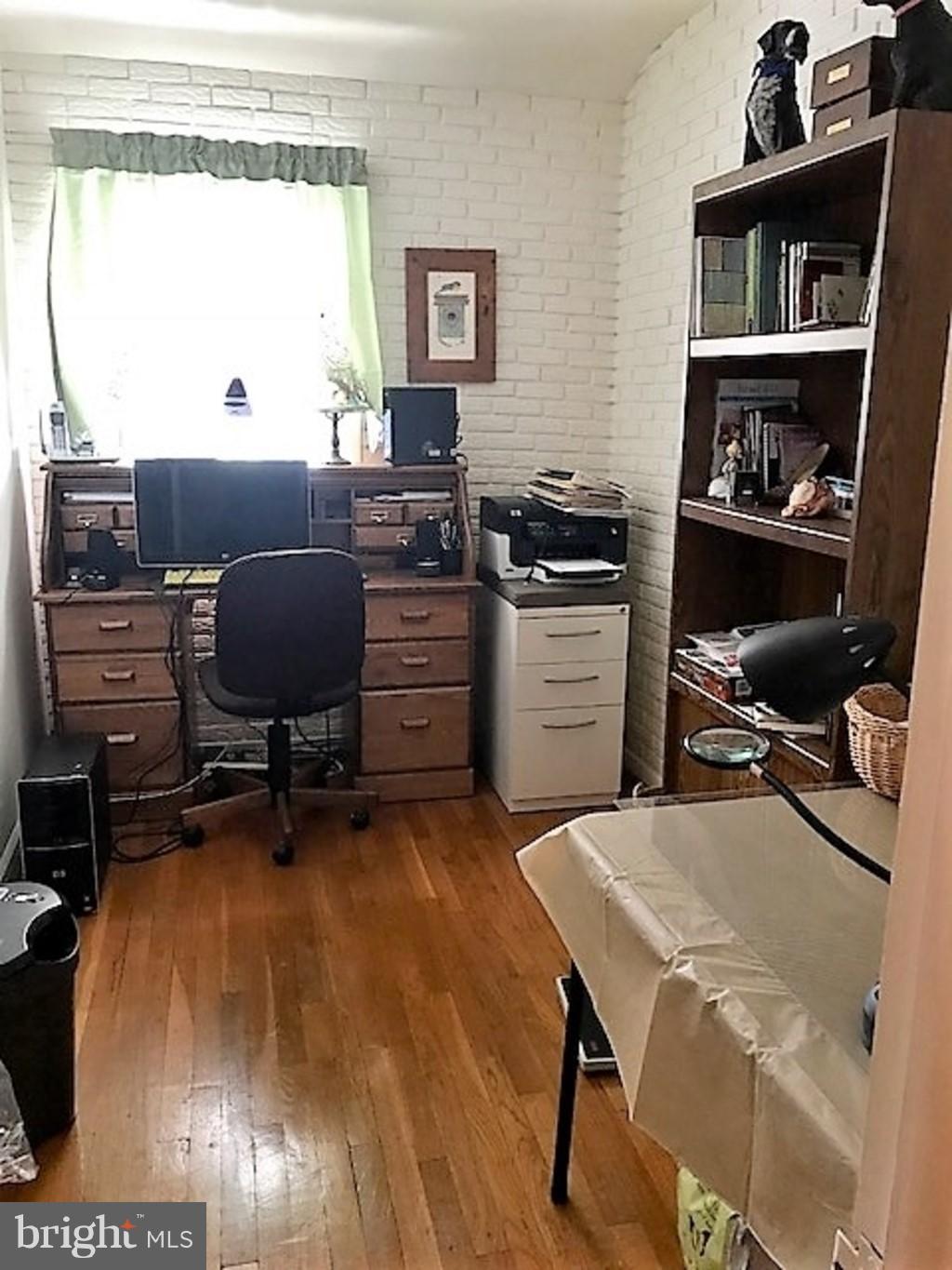 4414 Scotia Road Baltimore, MD 21227 - Photo 11 of 19 a workspace with furniture and a window