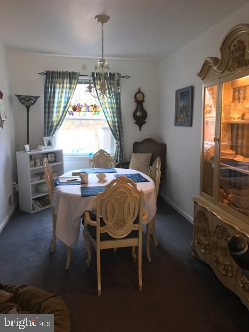 4414 Scotia Road Baltimore, MD 21227 - Photo 4 of 19 a table and chairs in a room