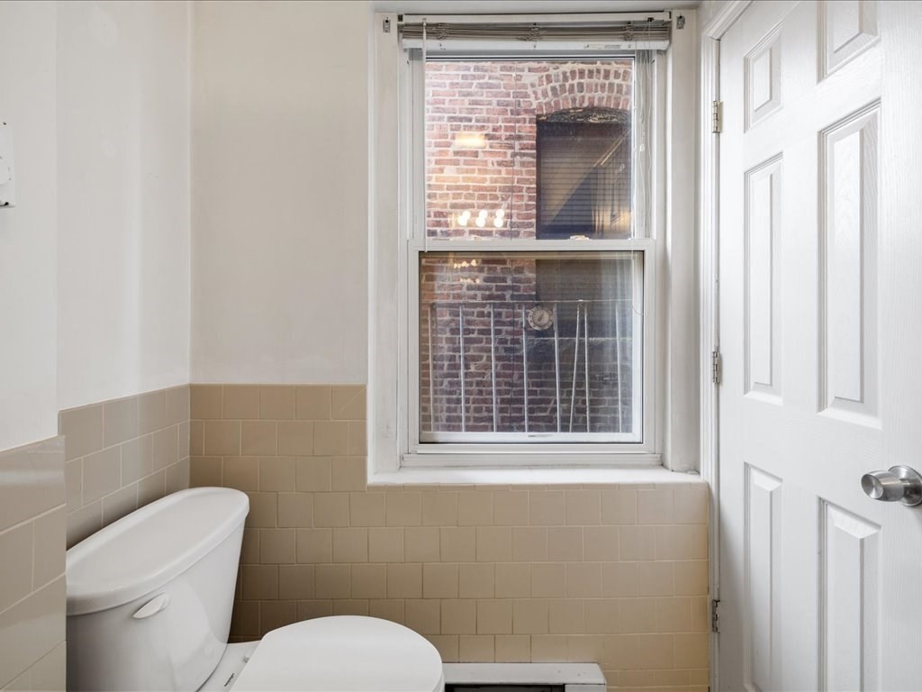 345-347 Hanover Street Boston, MA 02113 - Photo 16 of 22 a bathroom with a toilet