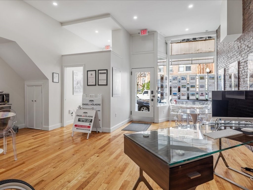 345-347 Hanover Street Boston, MA 02113 - Photo 5 of 22 a dining hall with stainless steel appliances furniture a large window and a wooden floor