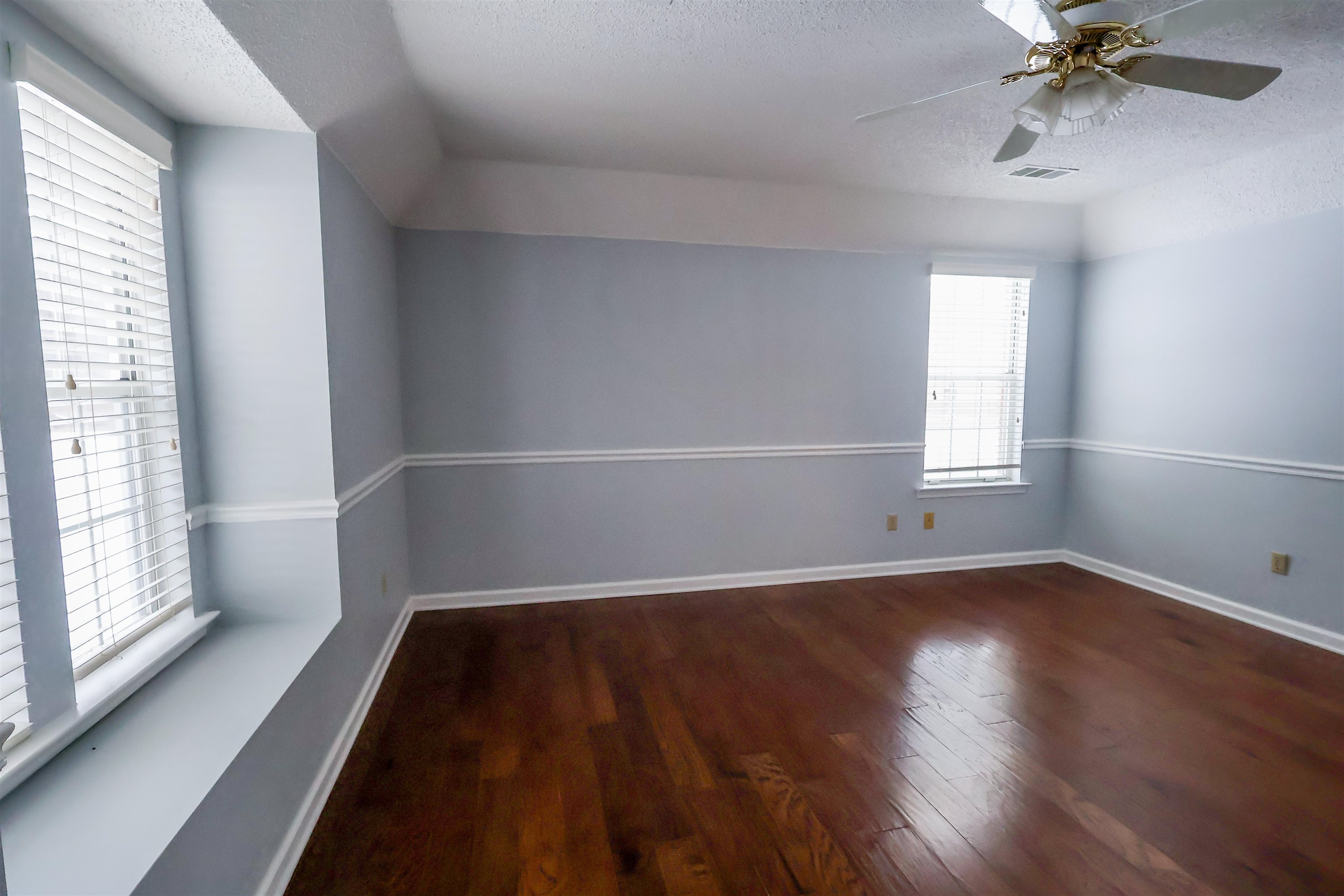 8712 Gragg Road Millington, TN 38053 - Photo 11 of 36 Bonus room featuring dark wood finished floors, a textured ceiling, and ceiling fan