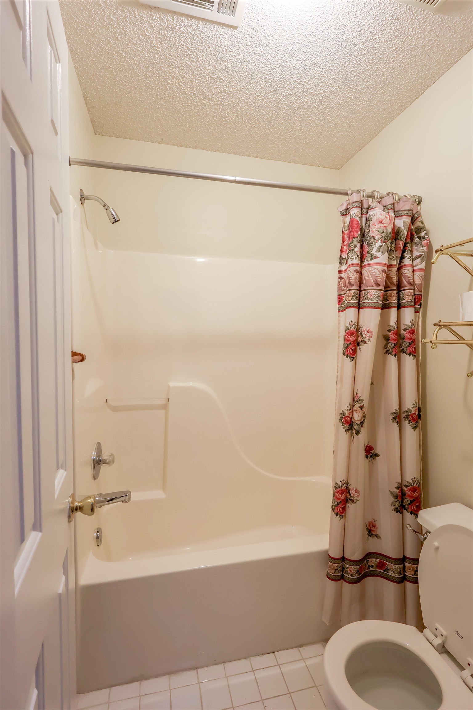 8712 Gragg Road Millington, TN 38053 - Photo 12 of 36 Full bath with shower / bath combo, a textured ceiling, and light tile patterned floors