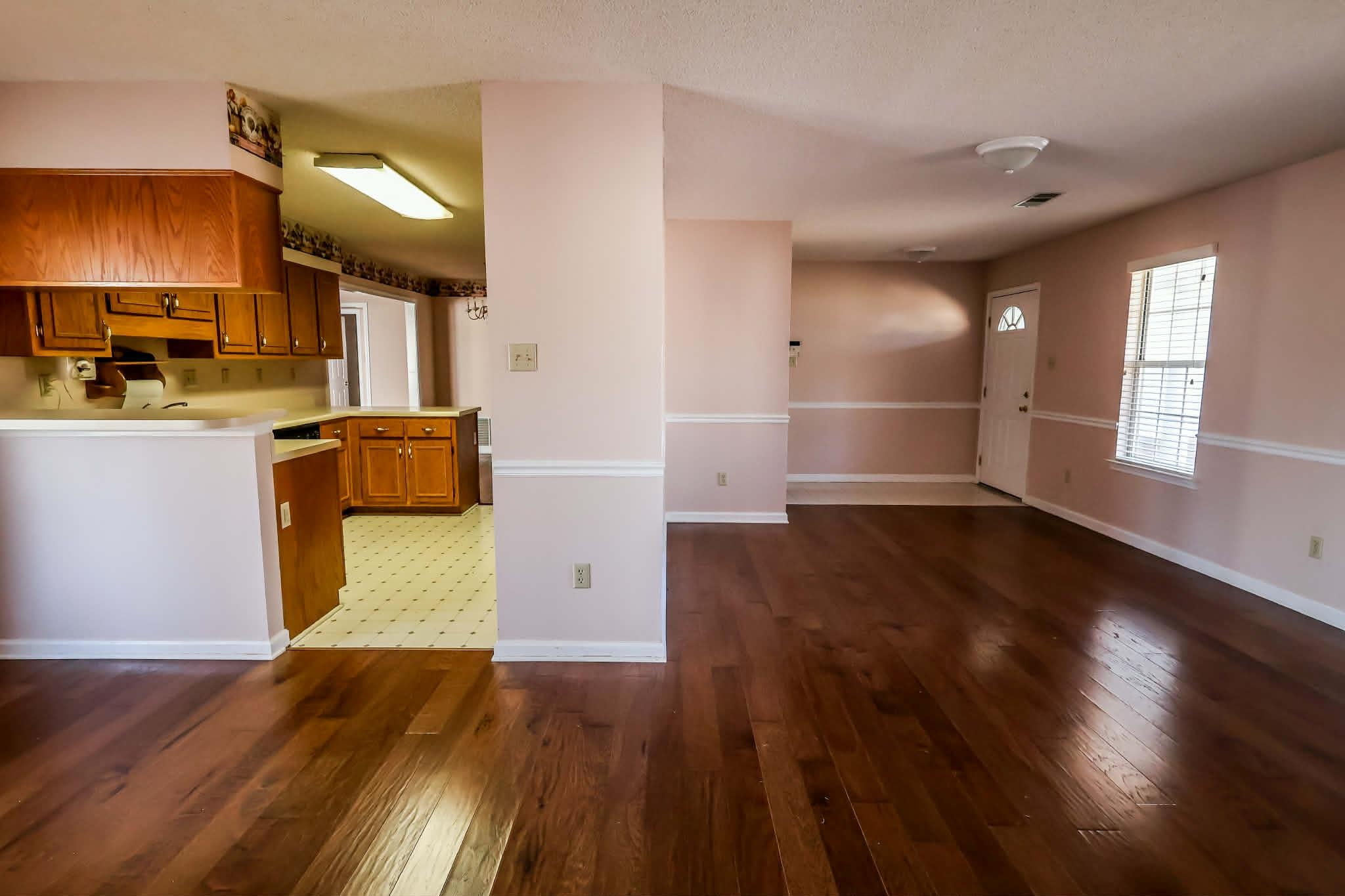 8712 Gragg Road Millington, TN 38053 - Photo 14 of 36 Kitchen featuring wood finish cabinets, light countertops, dark wood-style floors, and a peninsula