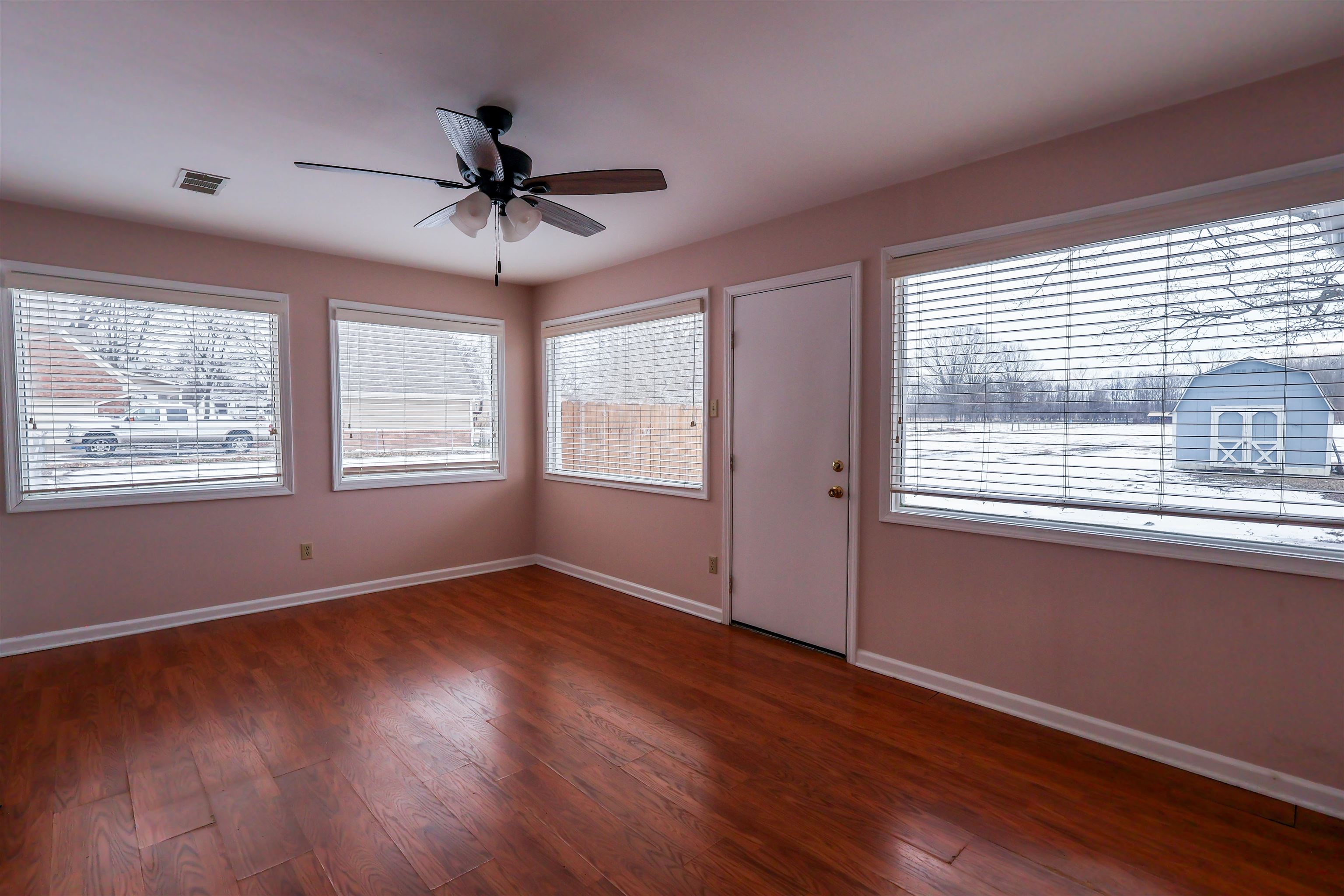 8712 Gragg Road Millington, TN 38053 - Photo 25 of 36 Unfurnished room with dark wood-style floors and ceiling fan