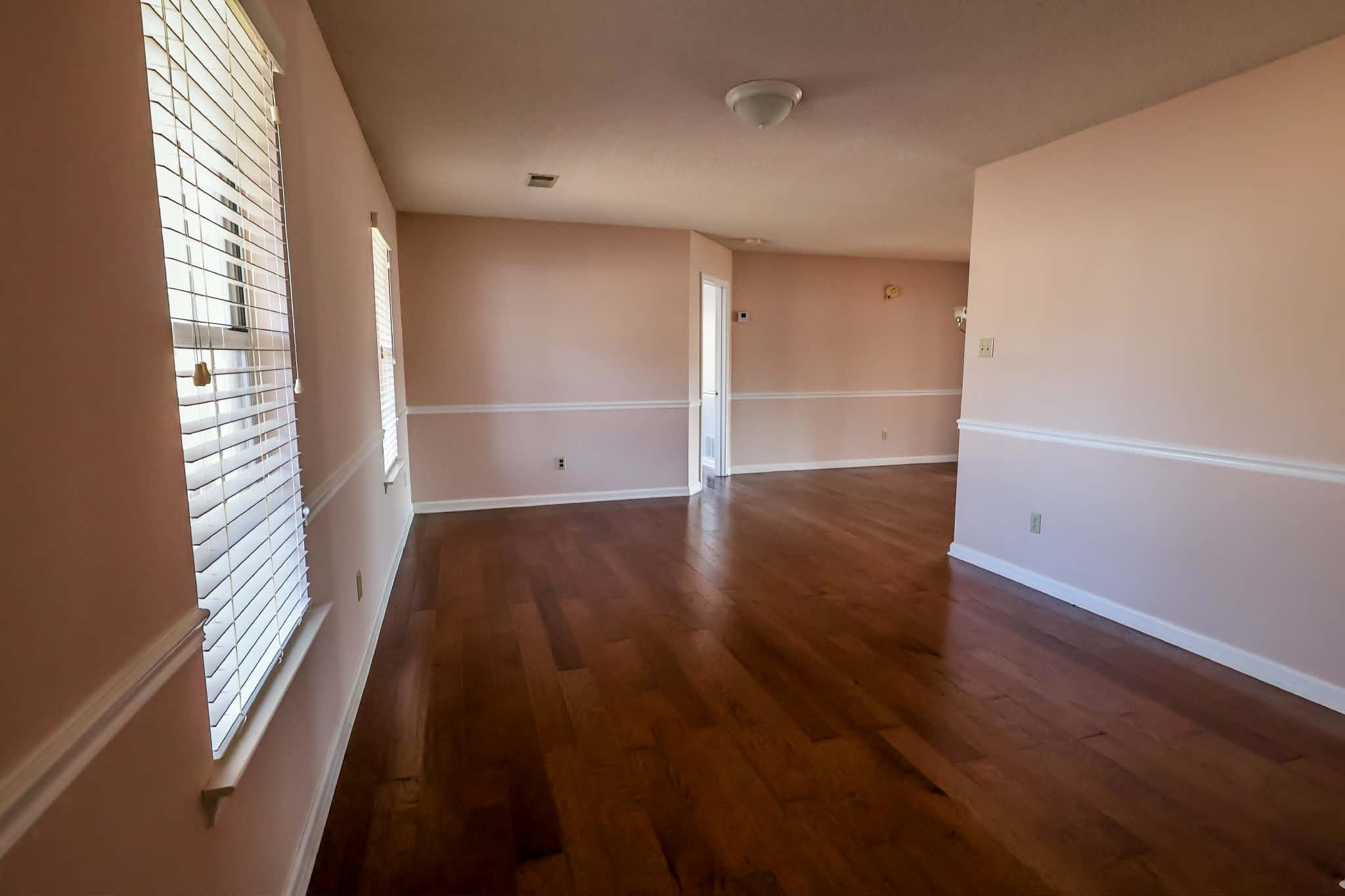 8712 Gragg Road Millington, TN 38053 - Photo 7 of 36 Empty room with dark wood-type flooring and baseboards