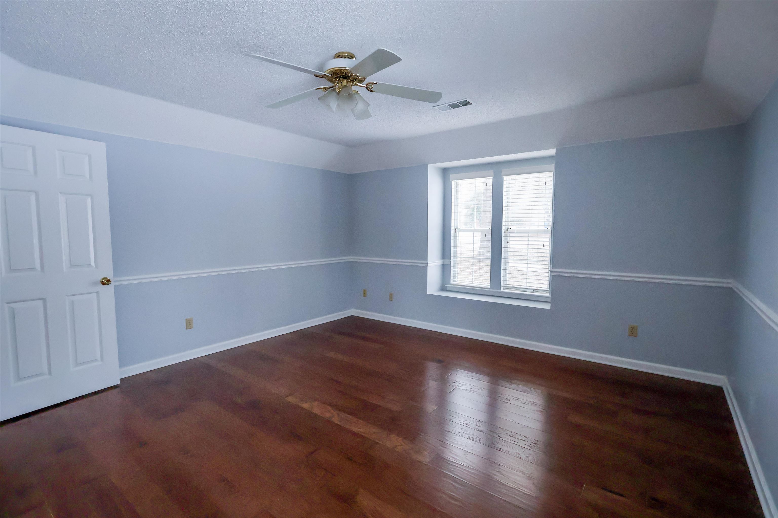 8712 Gragg Road Millington, TN 38053 - Photo 9 of 36 Unfurnished room featuring dark wood-type flooring and ceiling fan
