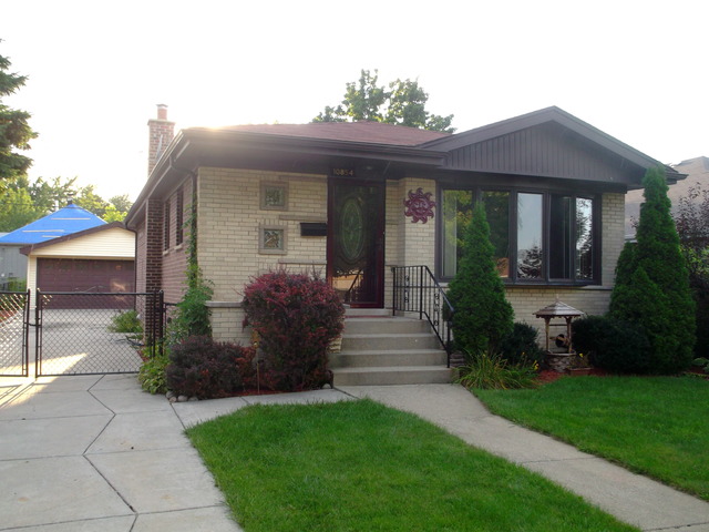 10854 Major Avenue Chicago Ridge, IL 60415 - Photo 2 of 24 a front view of a house with garden