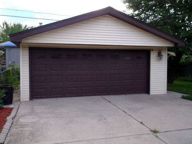10854 Major Avenue Chicago Ridge, IL 60415 - Photo 21 of 24 a front view of a house with garage