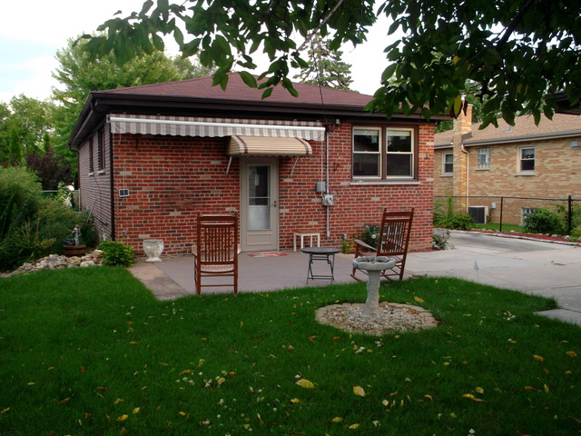 10854 Major Avenue Chicago Ridge, IL 60415 - Photo 23 of 24 a view of a chair and table in backyard of the house