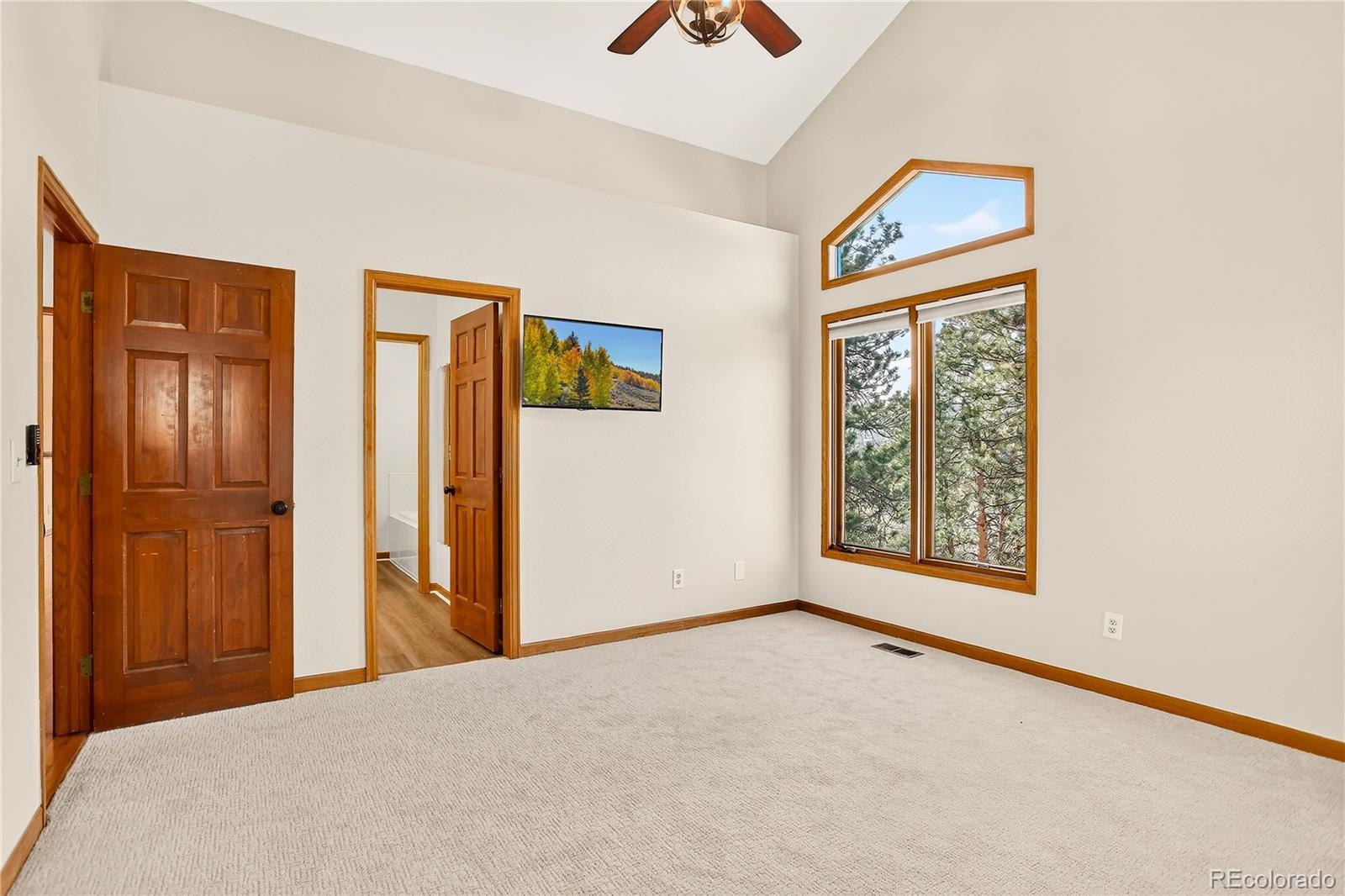 9758 Fallen Rock Road Conifer, CO 80433 - Photo 15 of 42 a view of an empty room with window and closet