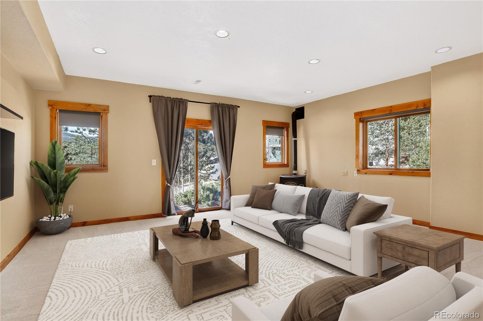 9758 Fallen Rock Road Conifer, CO 80433 - Photo 22 of 42 a living room with furniture and a couch