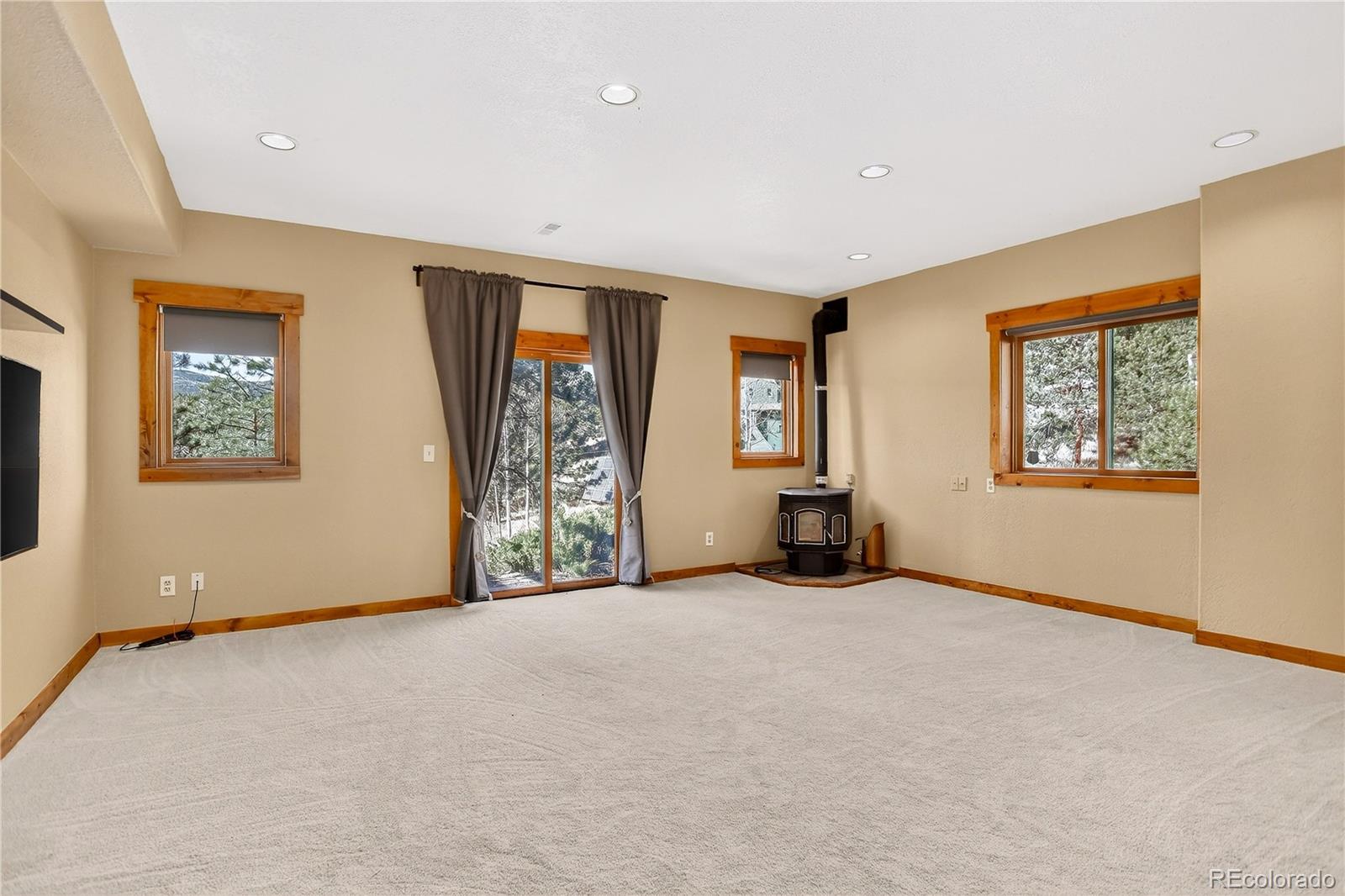 9758 Fallen Rock Road Conifer, CO 80433 - Photo 23 of 42 a view of a livingroom with a workspace