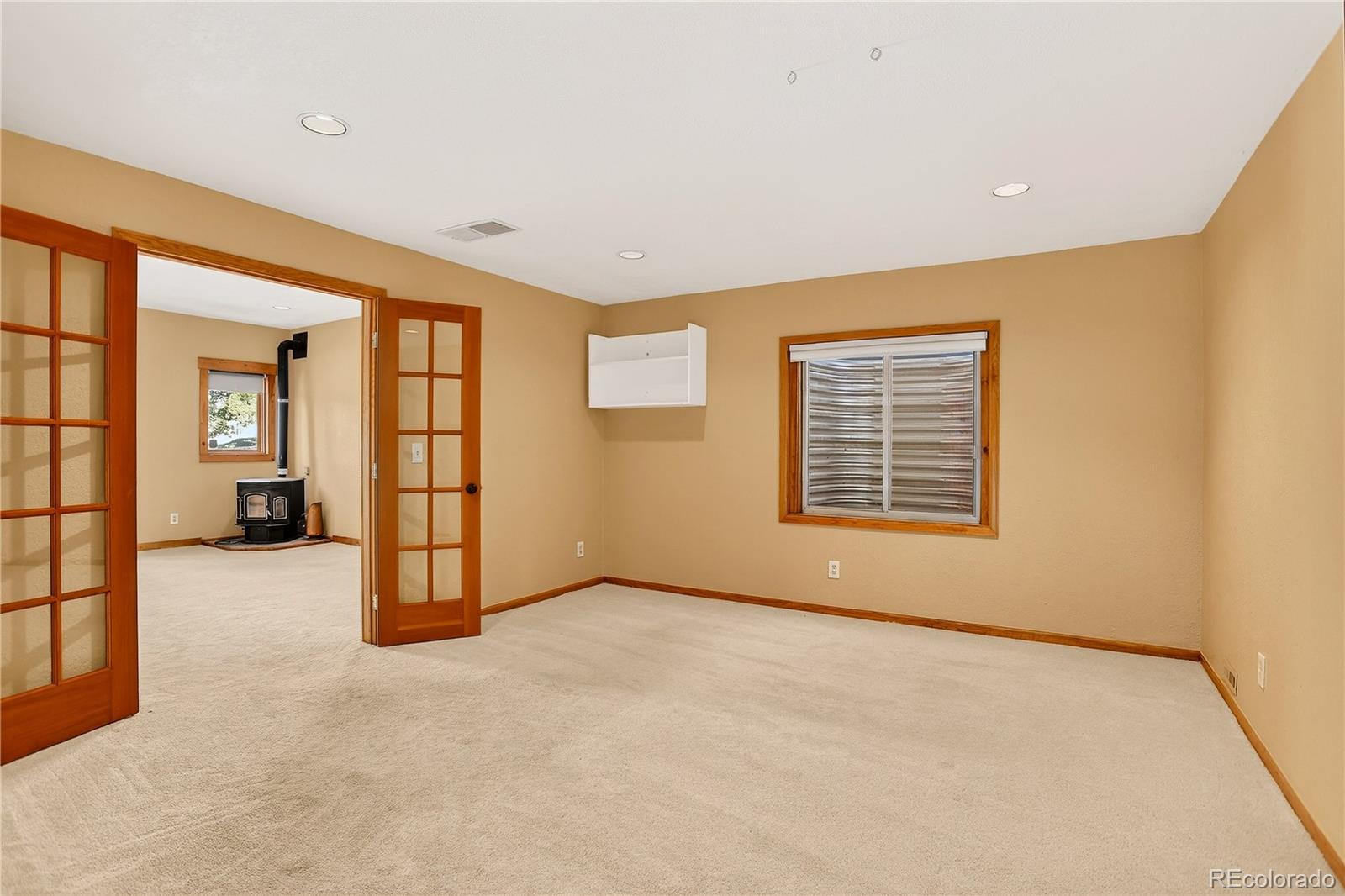 9758 Fallen Rock Road Conifer, CO 80433 - Photo 25 of 42 an empty room with windows