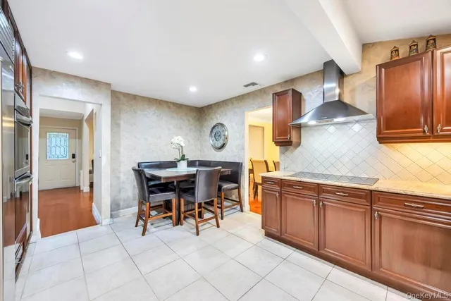 a kitchen with stainless steel appliances granite countertop a sink and cabinets