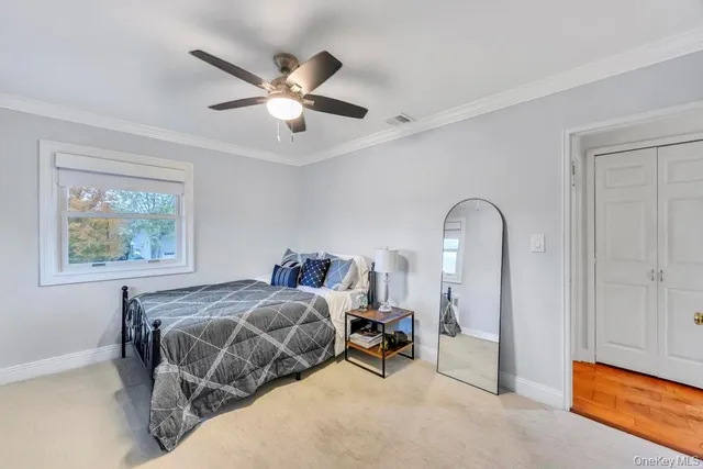 a bedroom with bed and a window