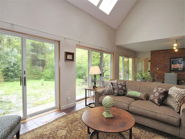 167 Tower Road Lincoln, MA 01773 - Photo 8 of 30 a living room with furniture and a large window