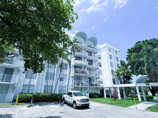 a front view of a building with garden