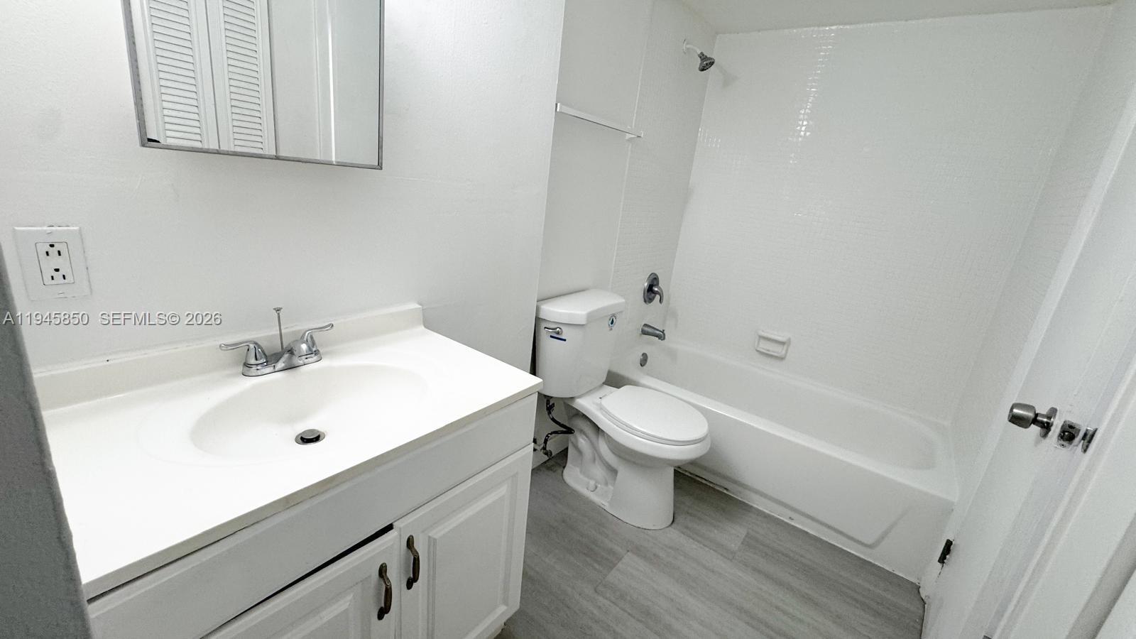 484 Northwest 165th St Road, Unit A314 Miami, FL 33169 - Photo 15 of 35 a bathroom with a sink a toilet and bathtub