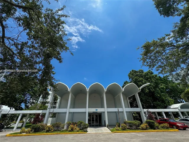 a front view of a building with garden