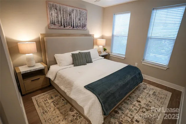 a bed room with a bed and a lamp