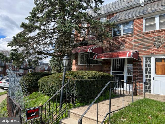 2586 Cranston Road Philadelphia, PA 19131 - Photo 27 of 37 a front view of a house with a garden