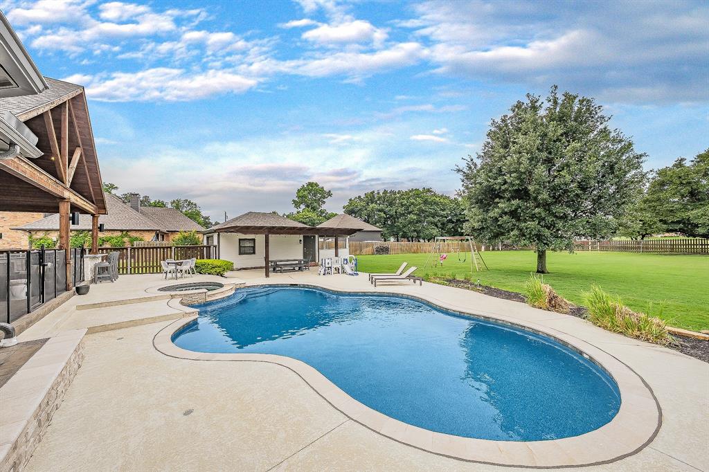 115 Pheasant Run Road Argyle, TX 76226 - Photo 35 of 40 a view of a swimming pool with a patio