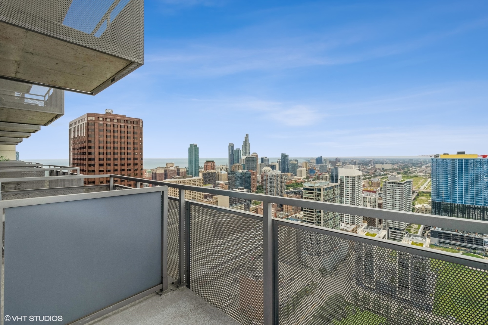 235 West Van Buren Street, Unit 4209 Chicago, IL 60607 - Photo 6 of 10 a view of a city skyline from a balcony