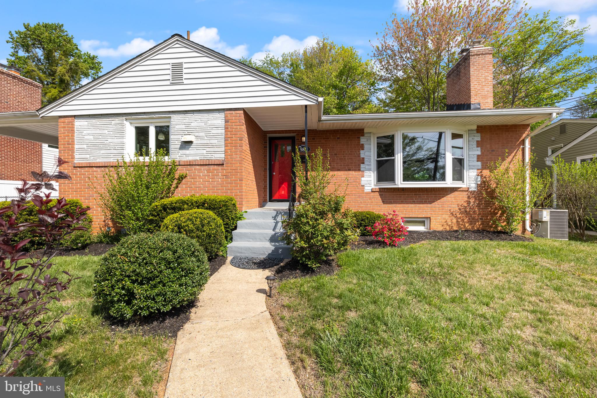 front view of a house with a yard