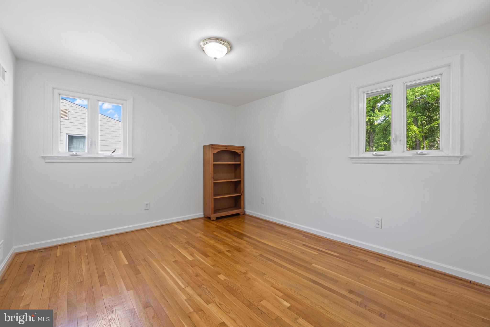 9821 Singleton Drive Bethesda, MD 20817 - Photo 19 of 45 an empty room with windows