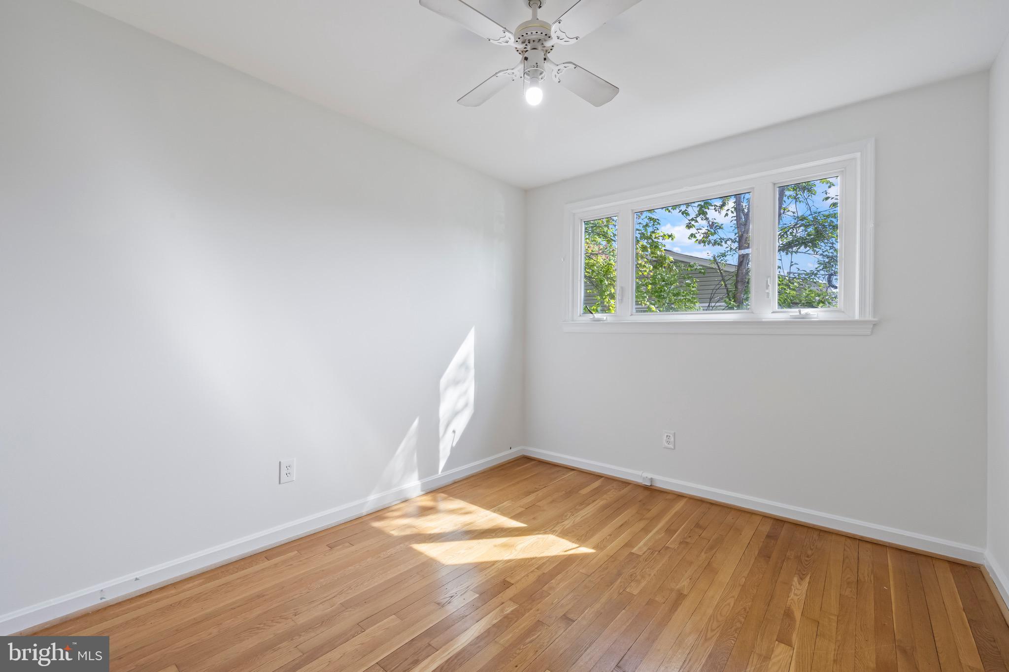 9821 Singleton Drive Bethesda, MD 20817 - Photo 21 of 45 wooden floor in an empty room with a window