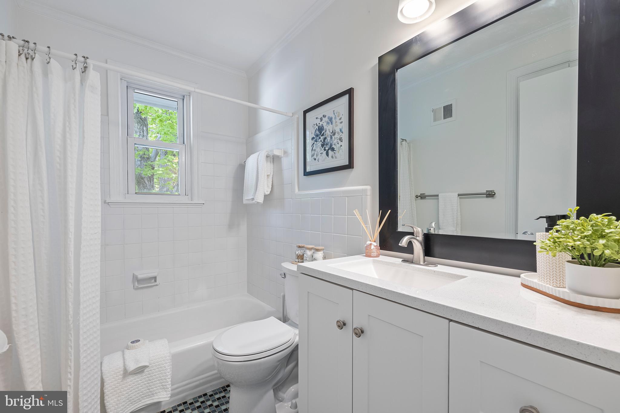 9821 Singleton Drive Bethesda, MD 20817 - Photo 23 of 45 a bathroom with a sink a toilet and shower