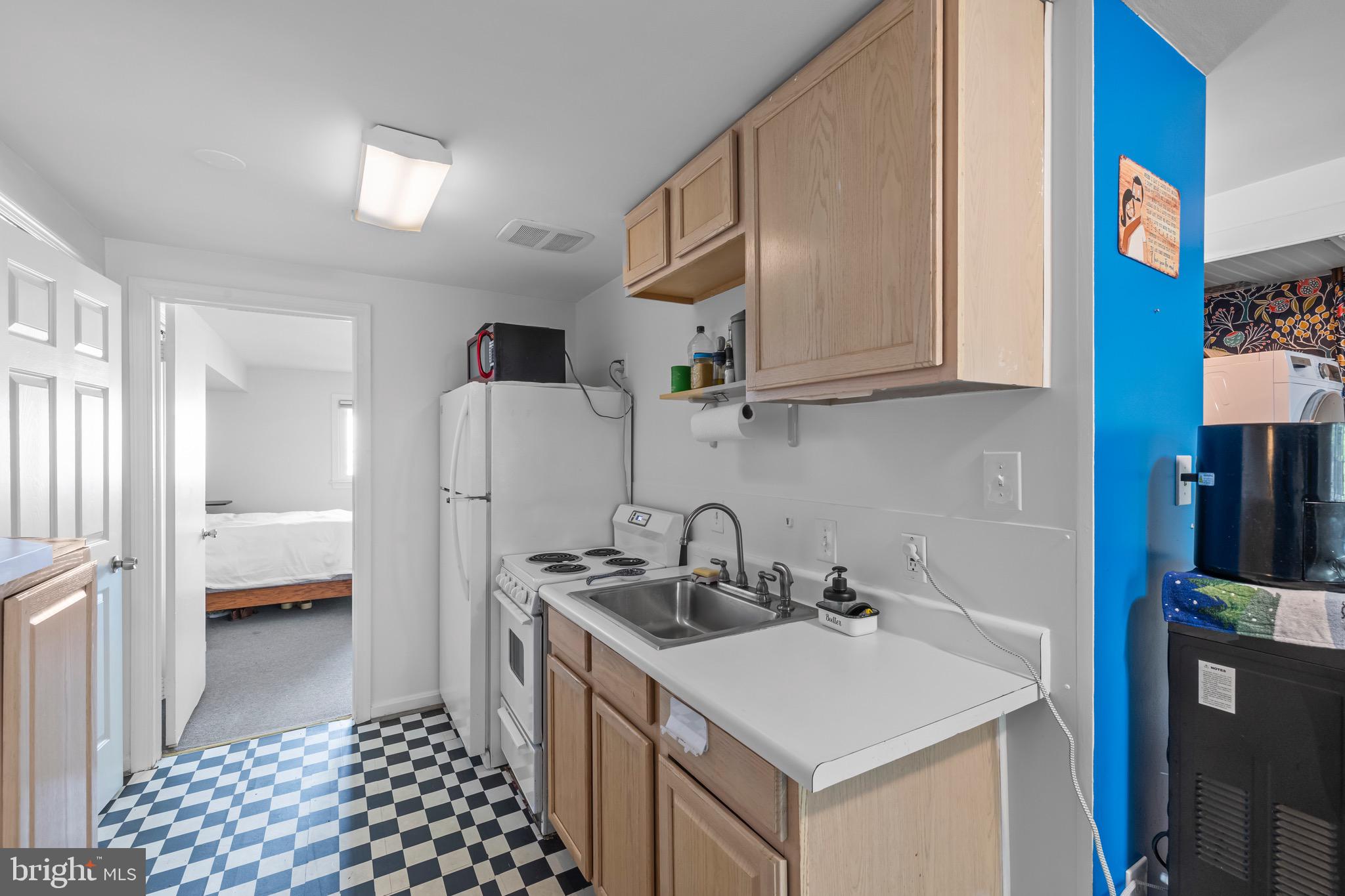 9821 Singleton Drive Bethesda, MD 20817 - Photo 26 of 45 a kitchen with a sink and a stove top oven