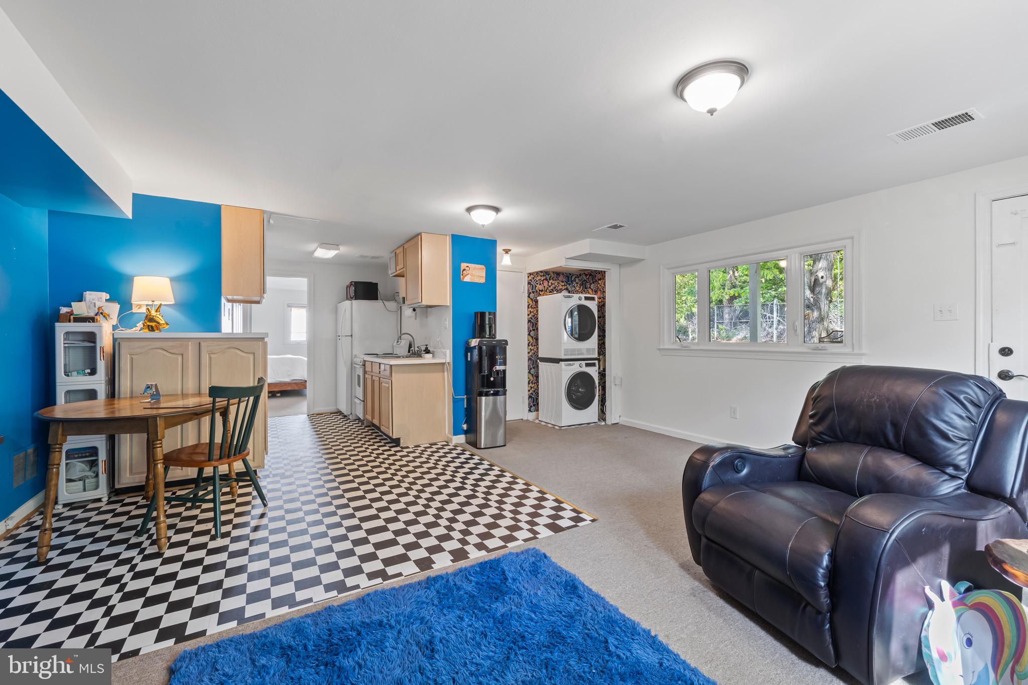 9821 Singleton Drive Bethesda, MD 20817 - Photo 28 of 45 a living room with furniture and a rug