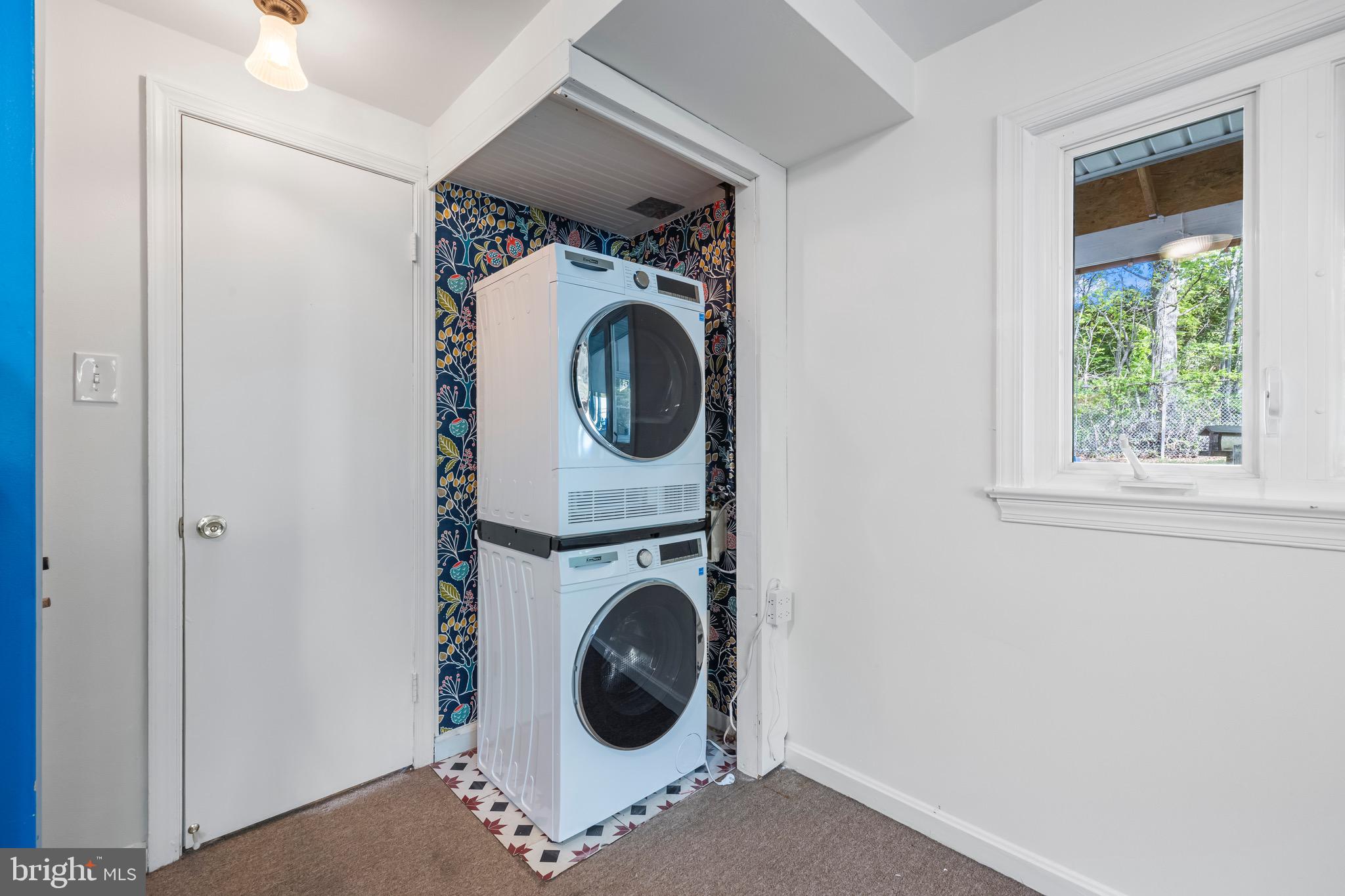 9821 Singleton Drive Bethesda, MD 20817 - Photo 29 of 45 a utility room with dryer and washer
