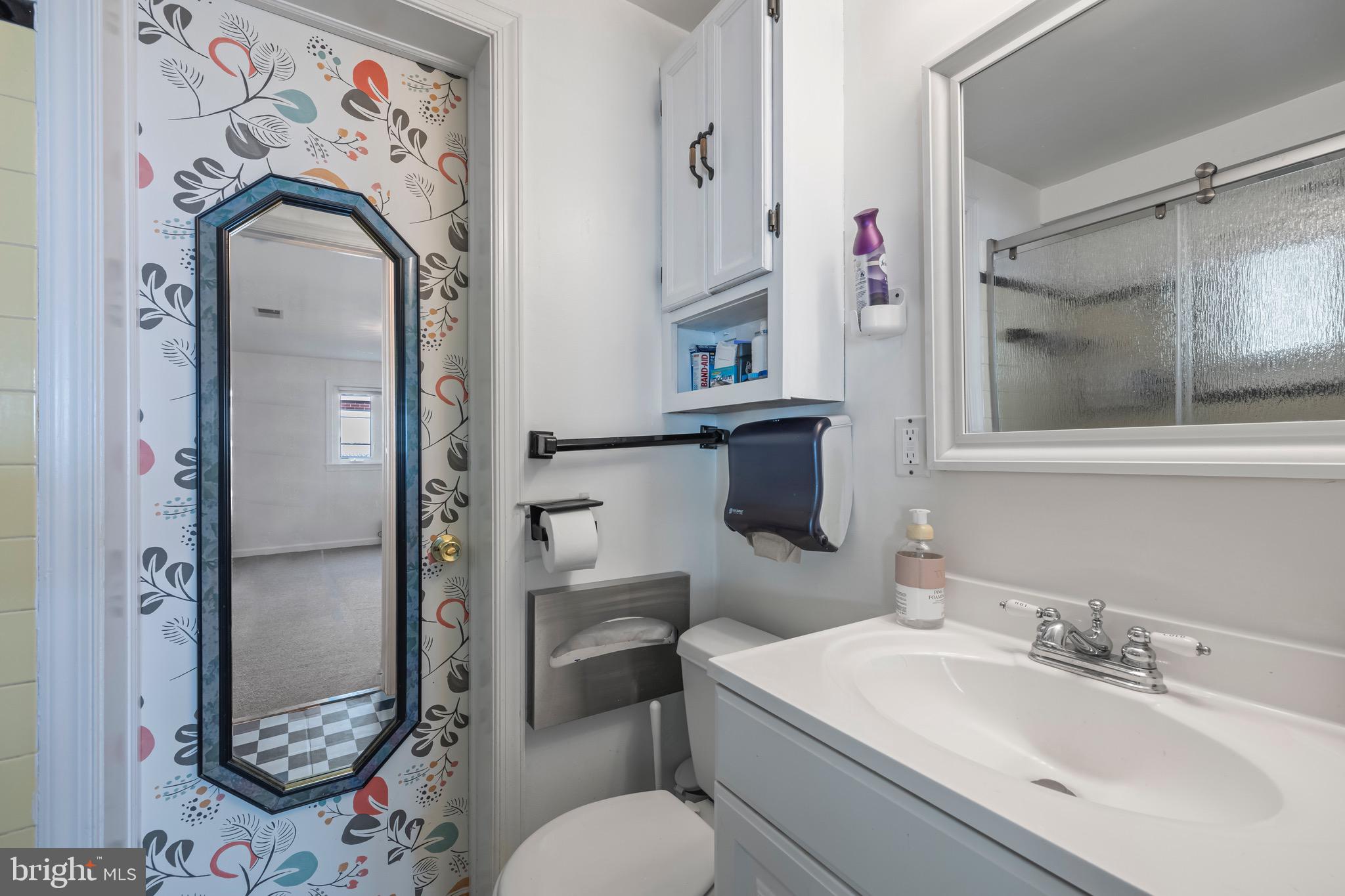 9821 Singleton Drive Bethesda, MD 20817 - Photo 32 of 45 a bathroom with a sink toilet and shower