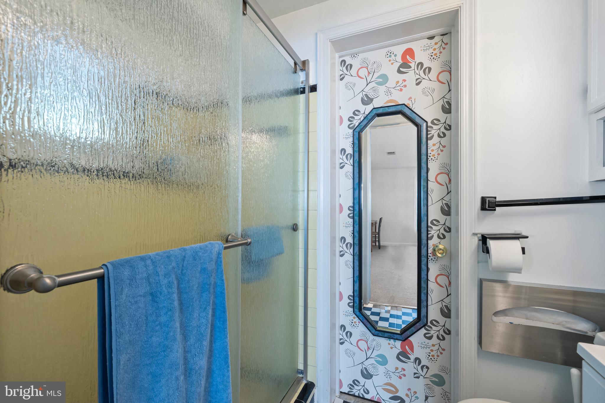 9821 Singleton Drive Bethesda, MD 20817 - Photo 33 of 45 a bathroom with a tub and shower